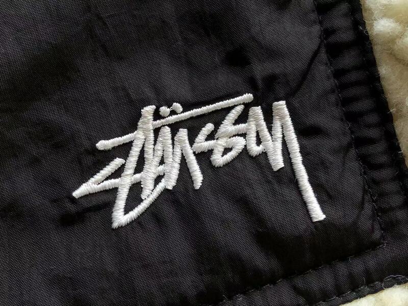 Jaqueta Stussy 8 Ball Sherpa Dupla Face